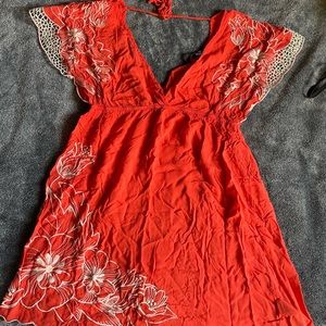 Bright orange floral shirt